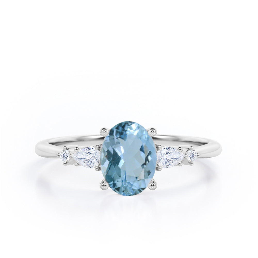 Classic Five Stone 0.6 carat Oval Aquamarine and Diamond Engagement Ring in Rose Gold