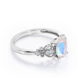 Swirly 0.5 carat Oval Moonstone and Diamonds Antique Engagement Ring in Rose Gold