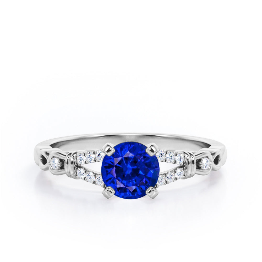 Split Shank 0.6 carat Round Blue Sapphire and Diamond Engagement Ring in Rose Gold