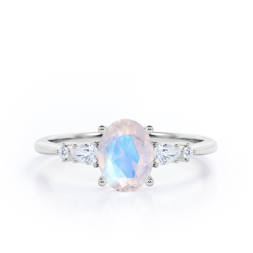 Classic Five Stone 0.6 carat Oval Moonstone and Diamond Engagement Ring in Rose Gold
