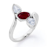 Distorted Line Three Stone 1 carat Oval and Pear Lab Ruby and moissanite Ring in Rose Gold