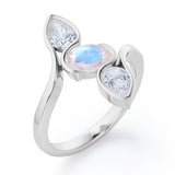 Distorted Line Three Stone 1 carat Oval and Pear Moonstone and moissanite Ring in Rose Gold