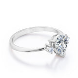 Minimalist Three Stone 0.55 carat Pear Moissanite and Diamond Engagement Ring in Rose Gold