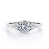 Tapered Classic 0.55 carat Round Moissanite and Diamond Engagement Ring in White Gold