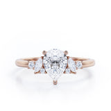 Fashionable 7 Stones 0.6 carat Pear Moissanite and Diamond Engagement Ring in Rose Gold