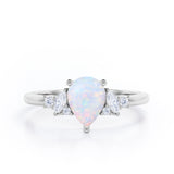 Seven Stone 0.6 Ct Pear Cut Lab Created Opal Engagement Ring