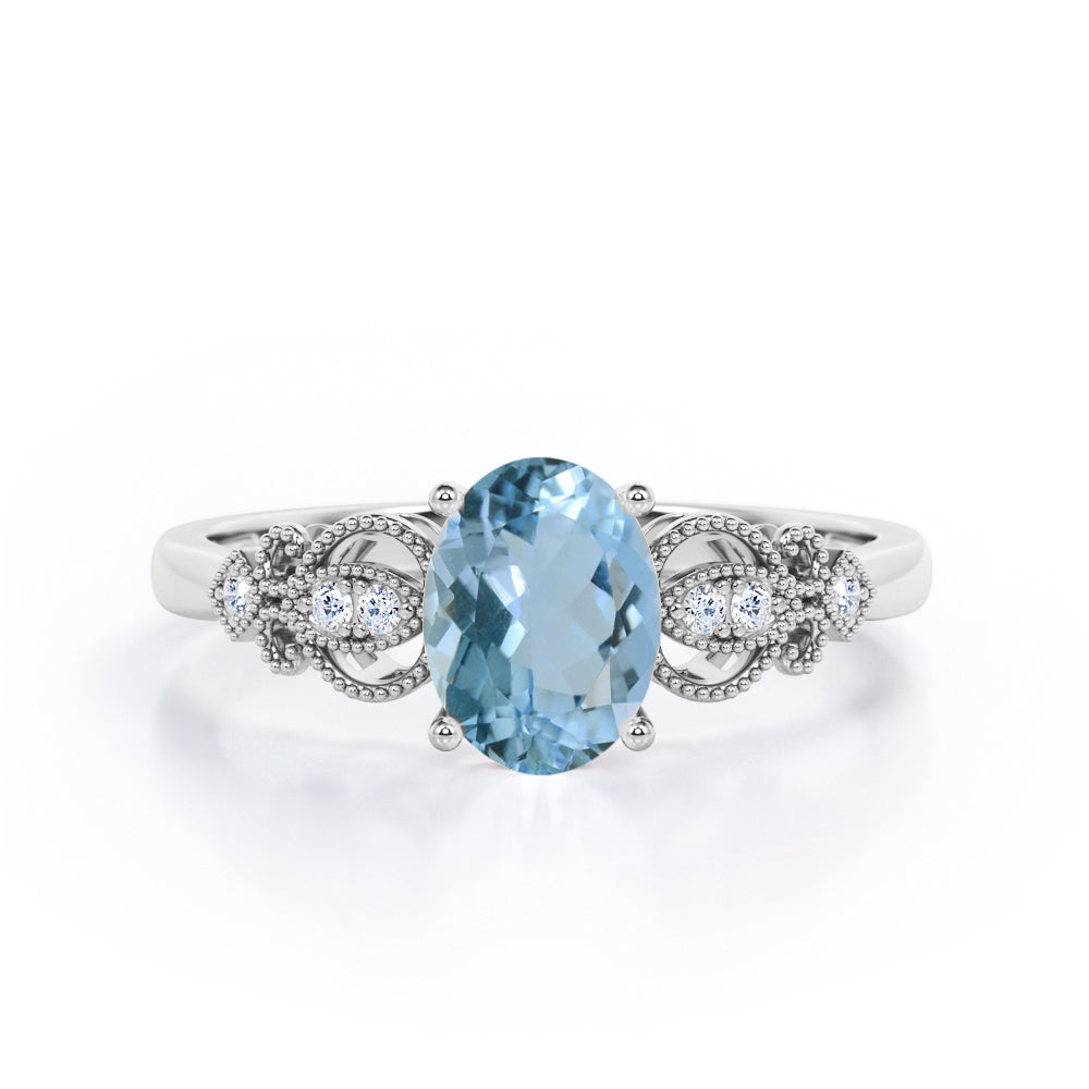 Swirly 0.5 carat Oval Aquamarine and Diamonds Antique Engagement Ring in Rose Gold