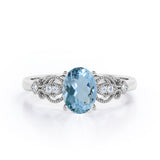 Swirly 0.5 carat Oval Aquamarine and Diamonds Antique Engagement Ring in Rose Gold